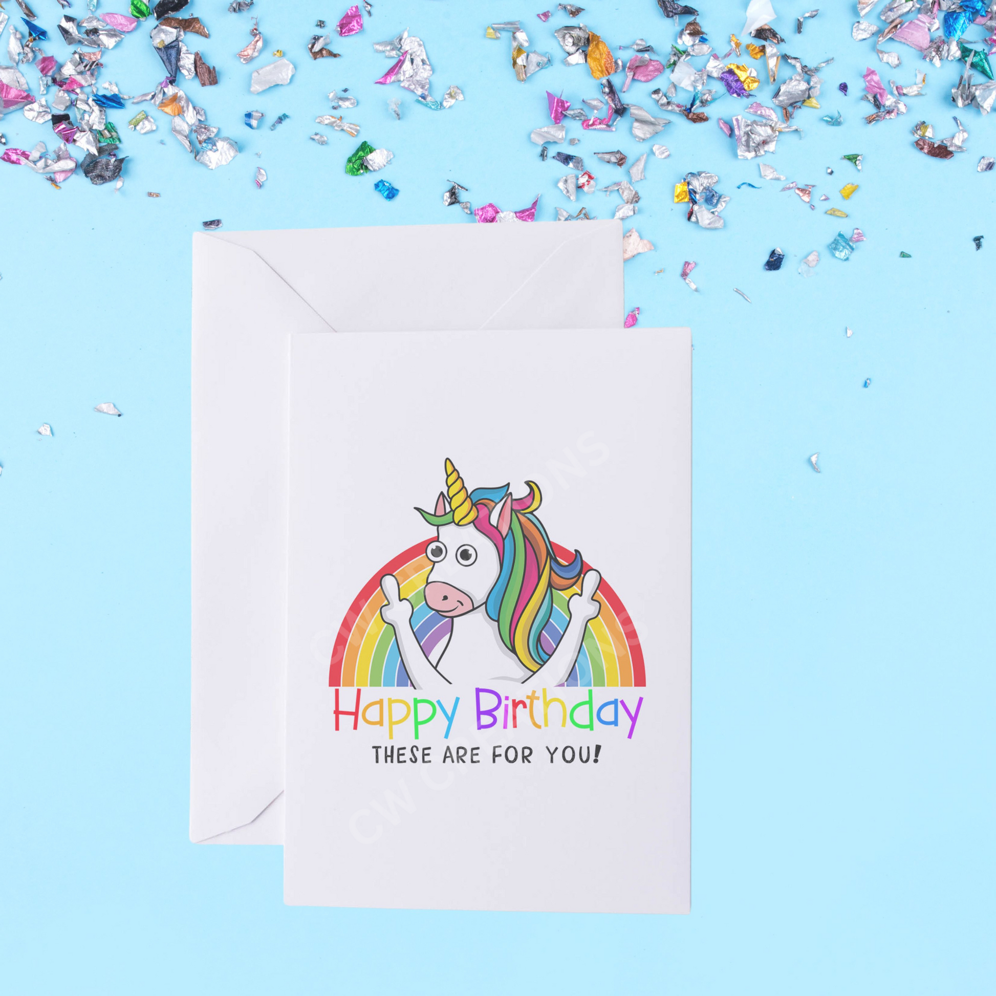 White card with bright colours a unicorn standing in front of rainbow sticking middle fingers up. Reading the words Happy Birthday These Are For You!