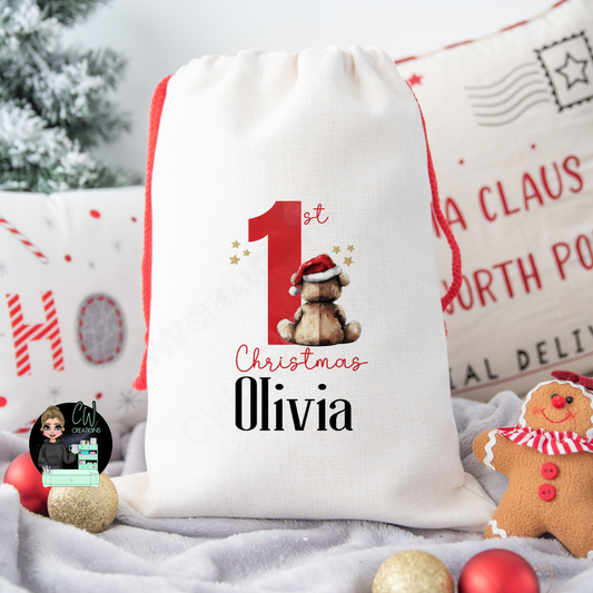 A linen Christmas sack with the words 1st Christmas personalised with a baby's name.