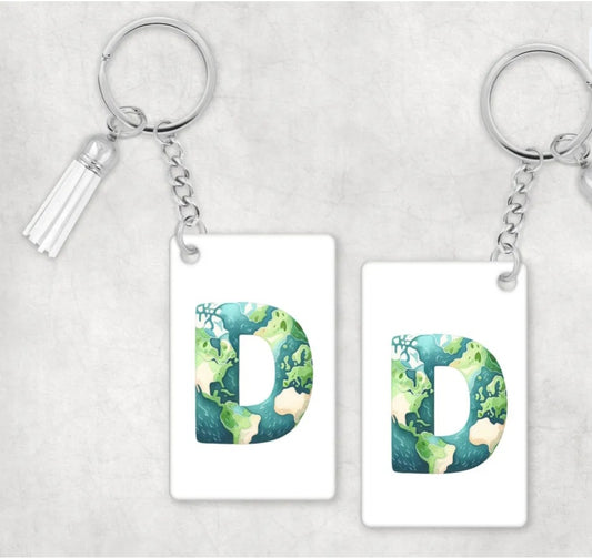 A white keyring with the letter D as a earth image