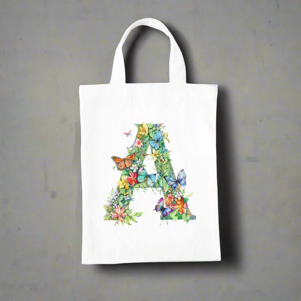 A white bag with the capital letter A covered in flowers and butterflies.