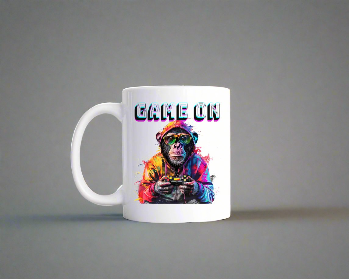 A white mug with the words Game On featuring a mug holding a controller.