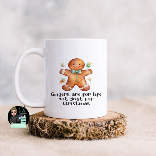 A white mug with an image of a gingerbread and the words Gingers are for life not just for Christmas.