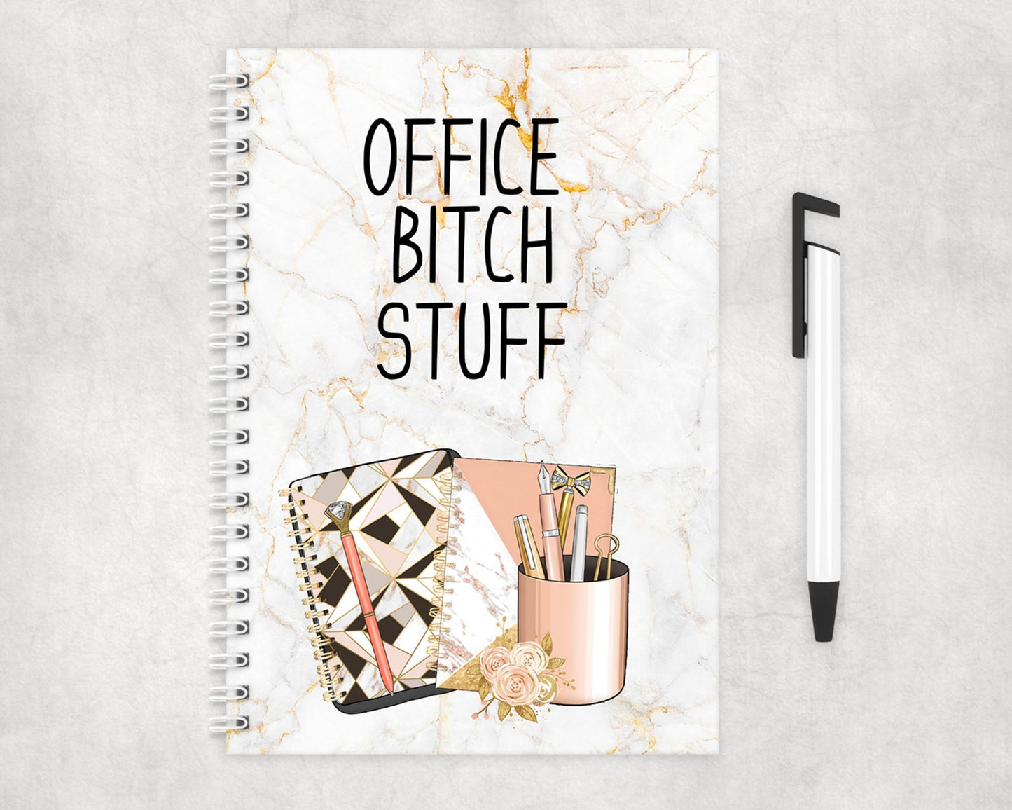 A notebook with a marble effect background and notebook graphics with the words Office Bitch Stuff.