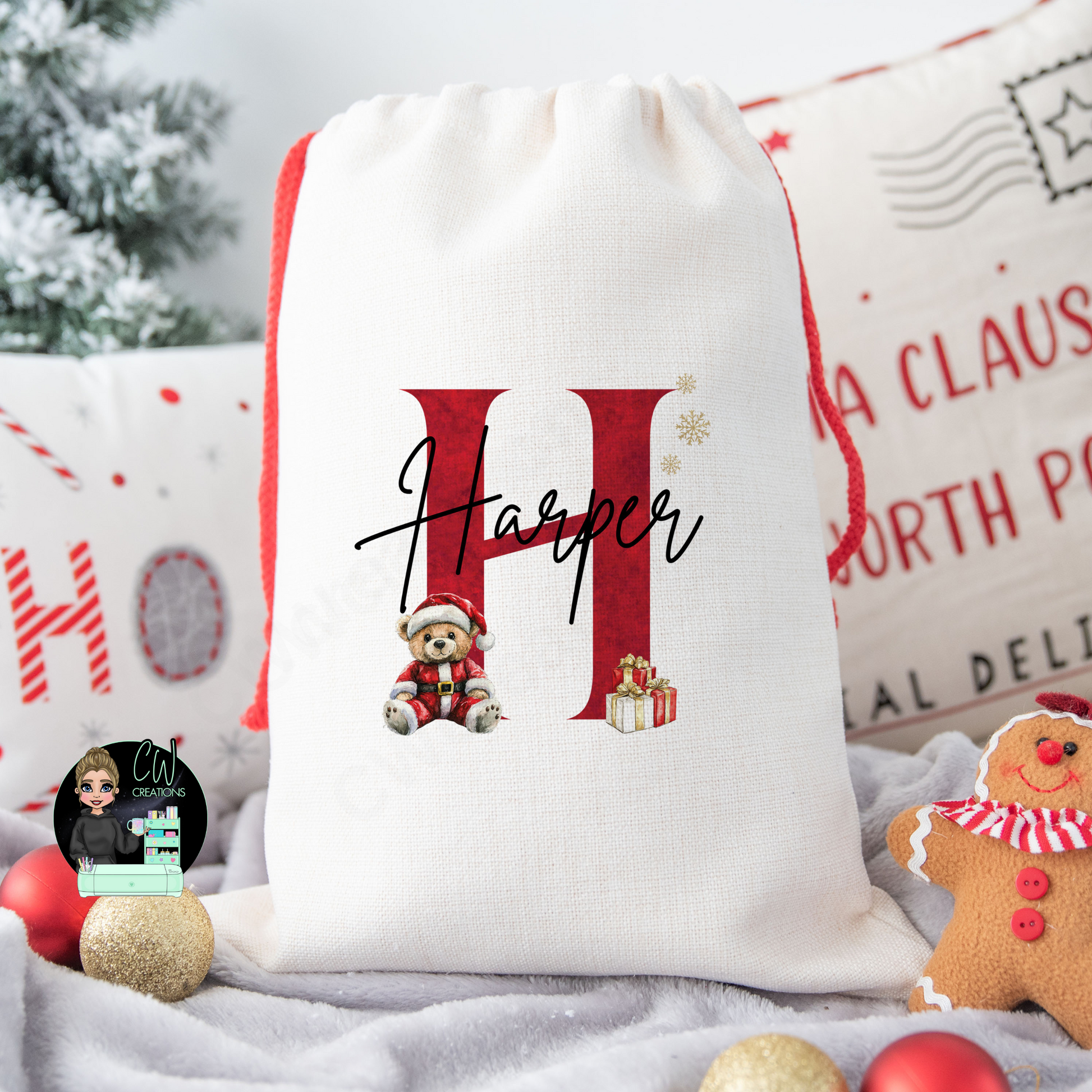 A linen Christmas sack Personalised with a initial and a name with a cute Christmas teddy and presents graphic