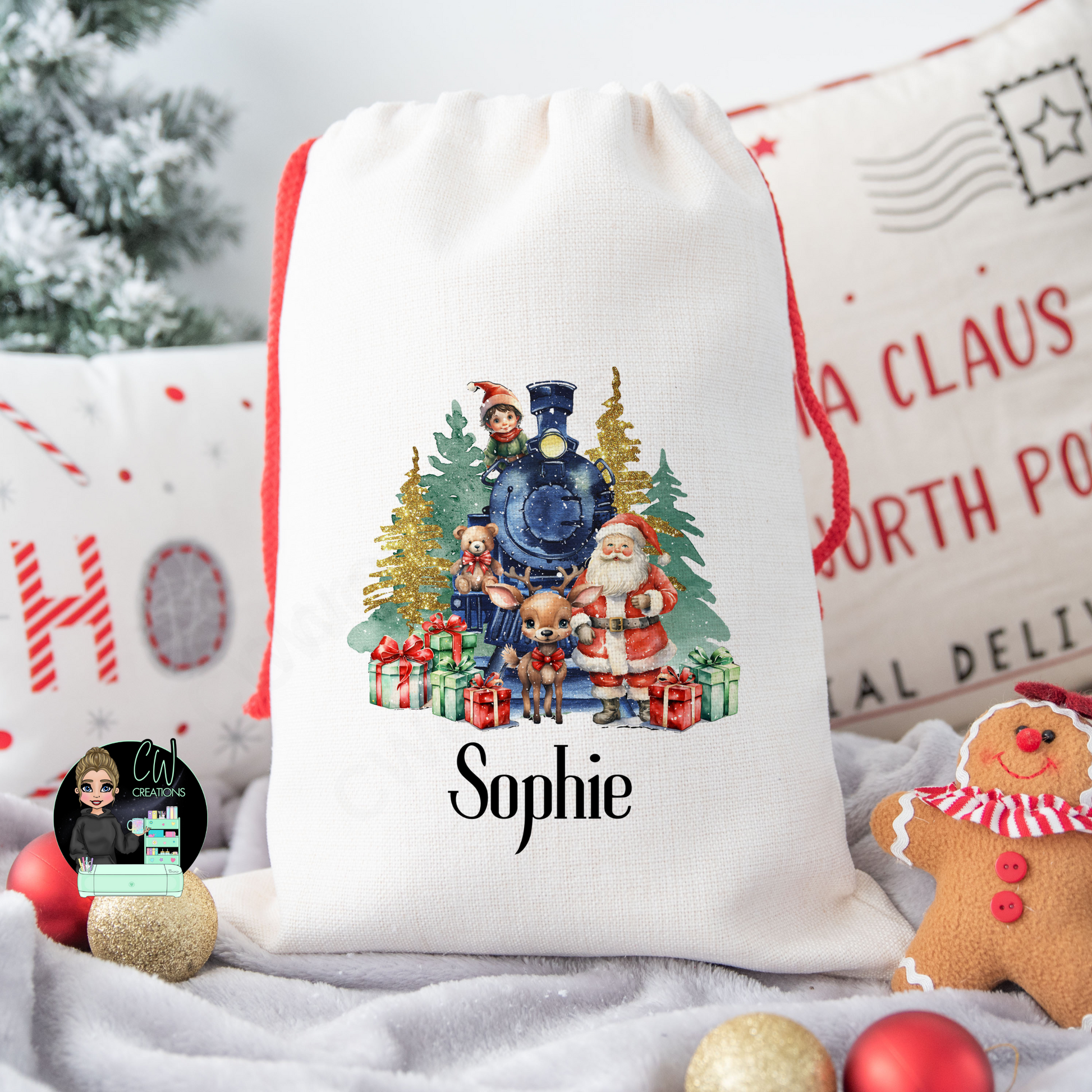 A linen Christmas sack with a Santa Claus, reindeer, elves, Christmas tree and a train personalised with a childs name.