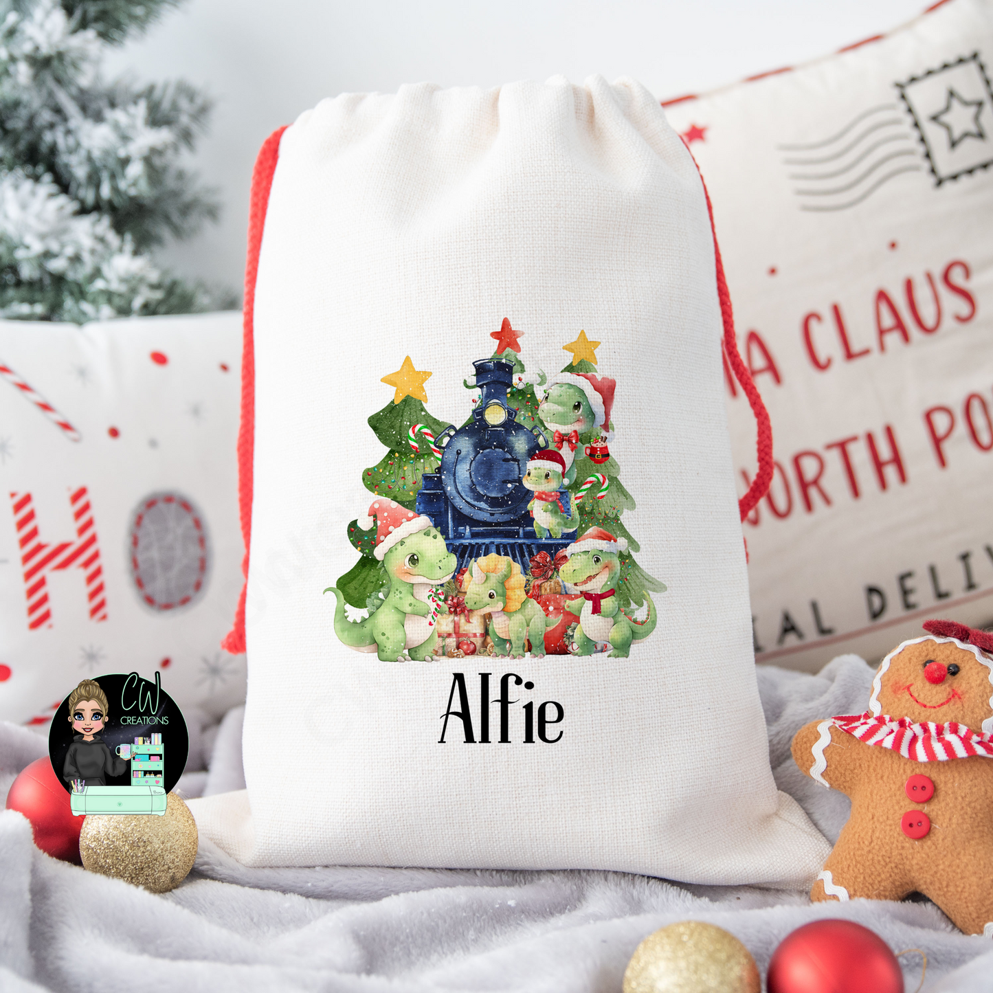 A linen Christmas sack with train, Christmas tree and dinosaurs personalised with a name.