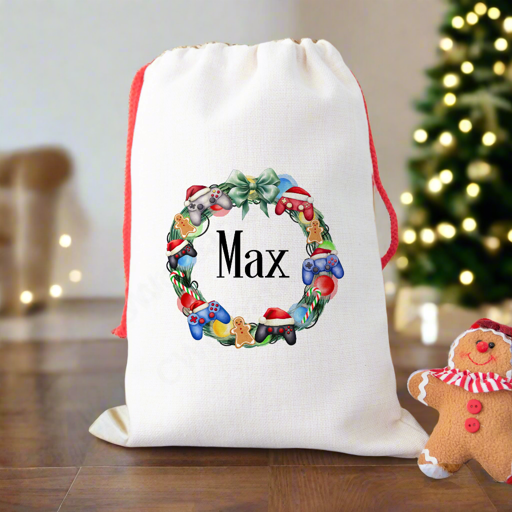 A linen Christmas sack with a gaming controller wreath personalised with a name