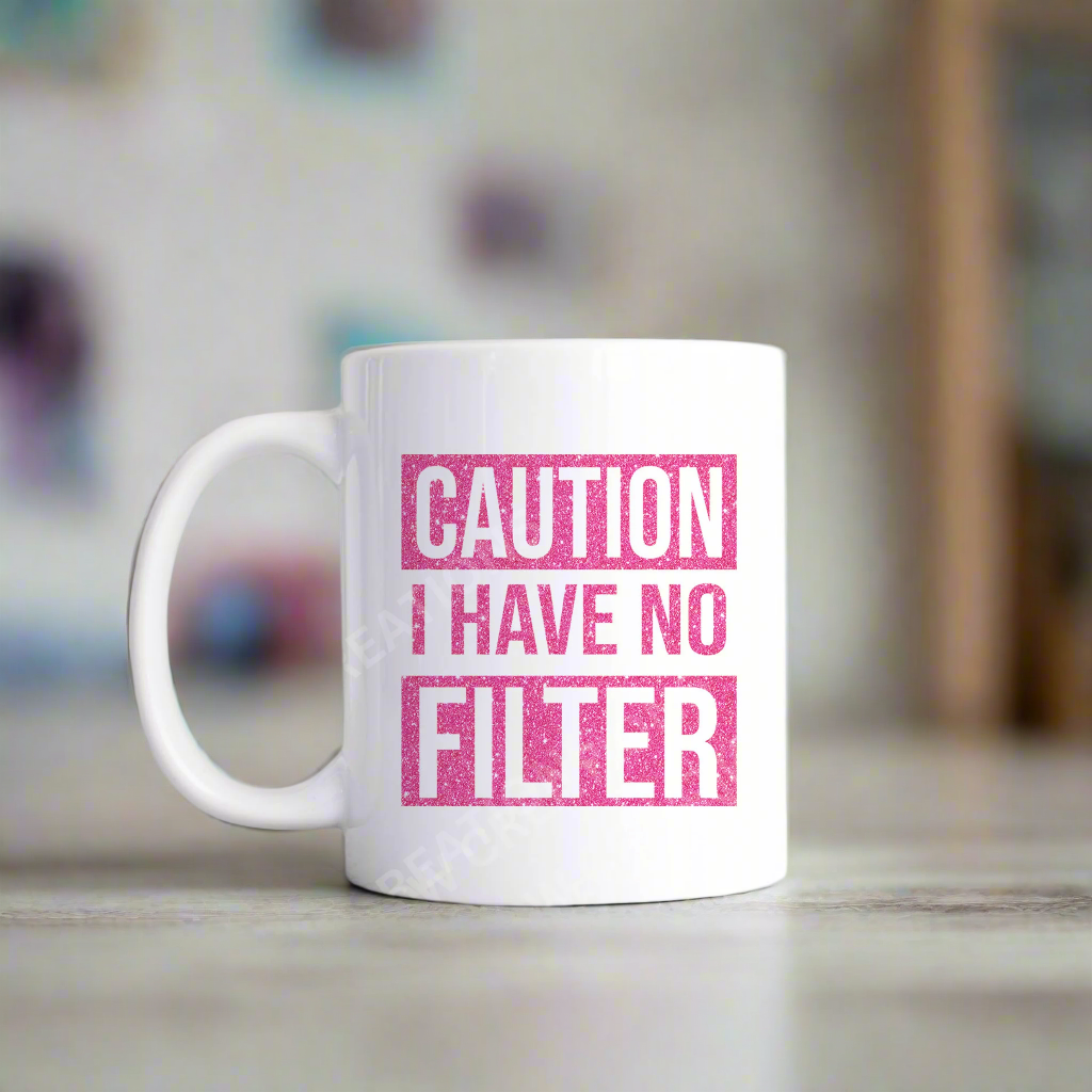 A coffee mug with the phrase "Caution: I Have No Filter" printed on it, emphasizing a bold and humorous attitude