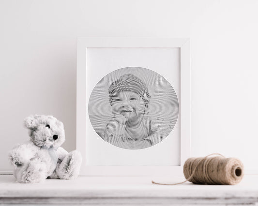  A personalized spiralized baby photo displayed alongside a soft teddy bear, capturing a moment of innocence and joy.
