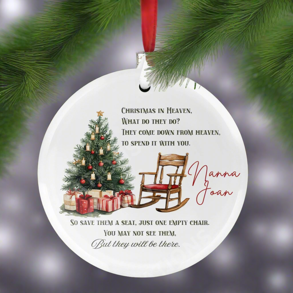 A Christmas ornament featuring a tree and rocking chair, symbolizing a heavenly memorial for loved ones during the holidays